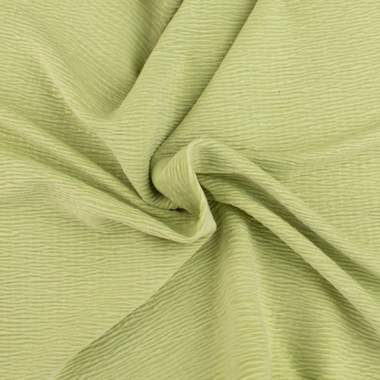Willow Haze sage green textured fabric with soft, handcrafted ripples for a cozy, premium nursery aesthetic.