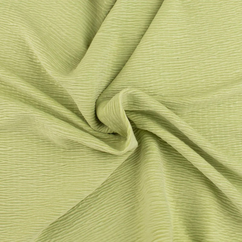 Willow Haze sage green textured fabric with soft, handcrafted ripples for a cozy, premium nursery aesthetic.
